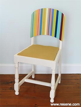 Repaint a plain chair to be a striped masterpiece