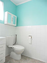 Transform a tired wallpapered bathroom