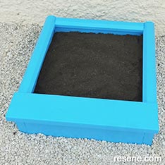 Build a mini sandpit for your children