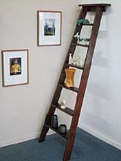 Turn an old wooden ladder into a fabulous shelving unit