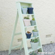 Upcycle an old wooden ladder into a plant stand
