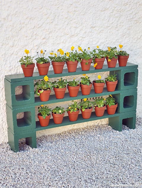 Make outdoor shelves for small potted plants