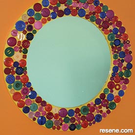 A multi-coloured mirror frame 