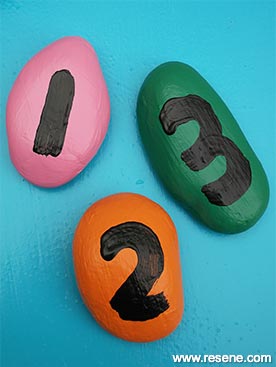 Paint stones with numbers