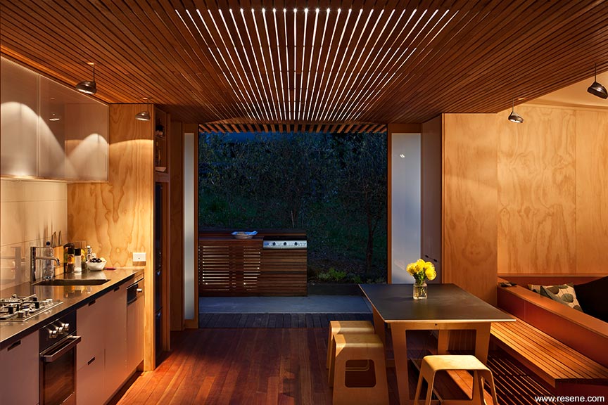 A plywood clad kitchen in an Onemana bach