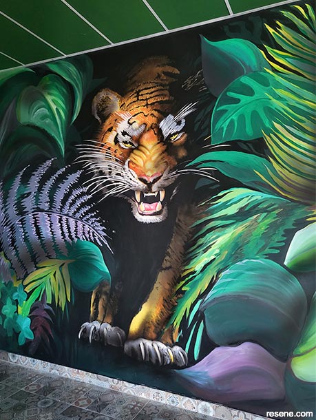 A tiger mural in a restaurant