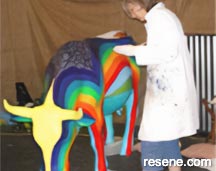 Kathy Ried painting the Resene Rainbow Cow