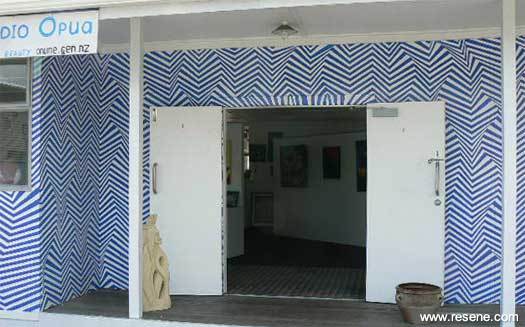 An Opua waterfront building is being transformed with a complicated geometric design mural