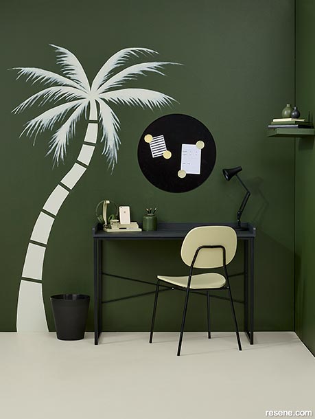 A dark forest green teen study with a palm tree mural