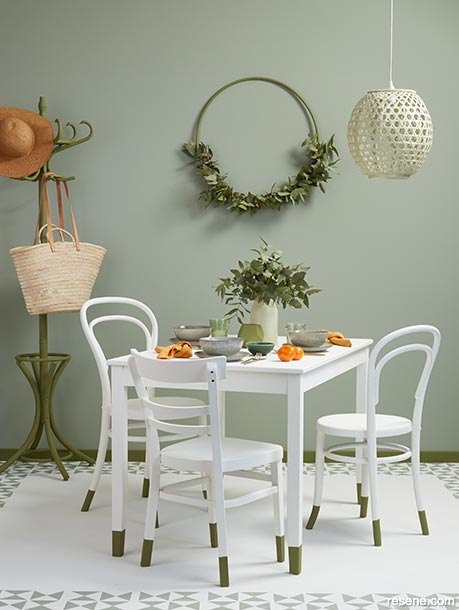 A botanical themed dining room with dipped legs on chairs