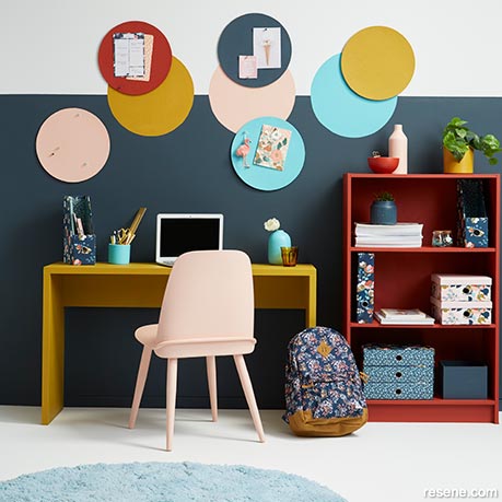 A child's workspace painted in bold colours