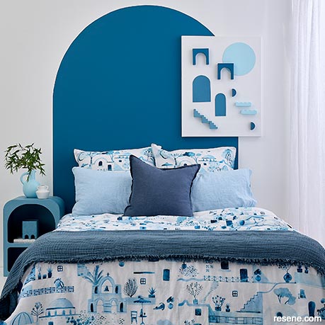 A blue and white coastal style bedroom