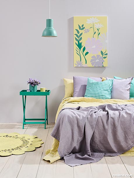 A bedroom in jade green, lilac and pastel yellow