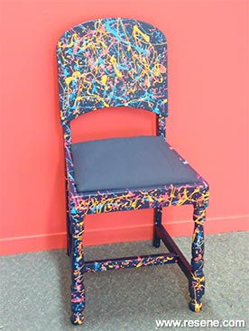 Paint a splatter effect on a chair