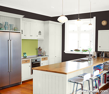 Contrast with bold wall colour used alongside more conservative shades in your kitchen