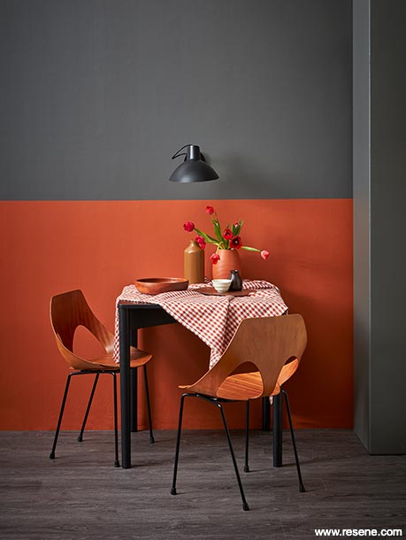A dark dining room using red colour blocking