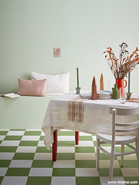Green chequered floor in dining room