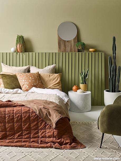 An olive green master bedroom