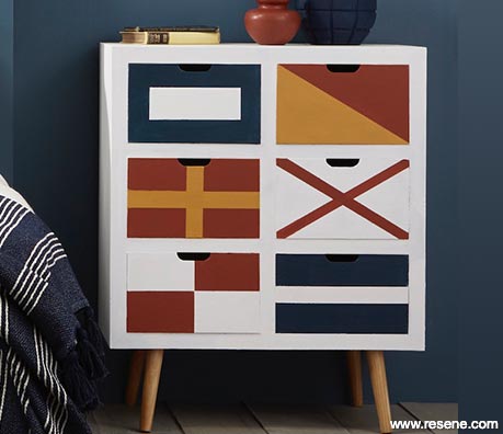 Nautical flags painted on drawers