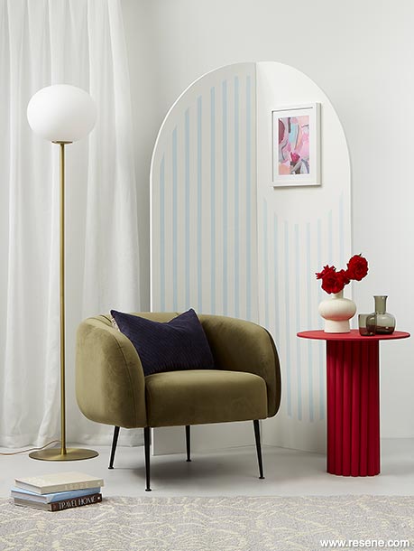 Red toned reading nook with art deco archway