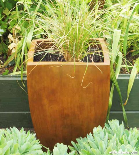 A plant pot painted with Resene FX Faux Rust Effect