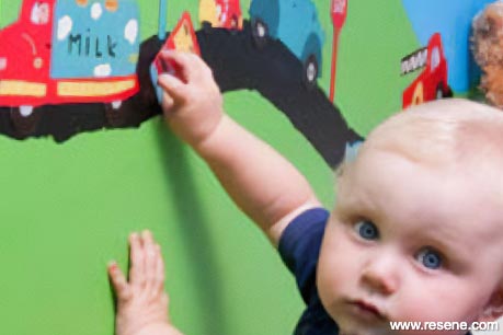 A painted magnetic toy road on wall