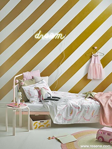 Gold striped room with pink and white accents