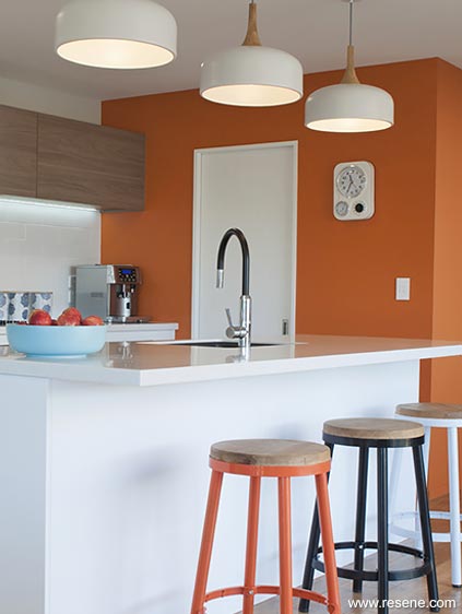 Orange feature wall in kitchen