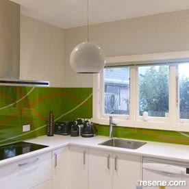Grey kitchen walls with green splashback