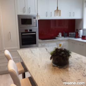 Cream, brown, and bold red kitchen