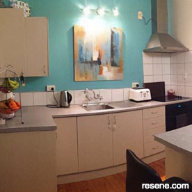 Kitchen with teal wall
