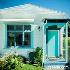 White and blue/green home exterior