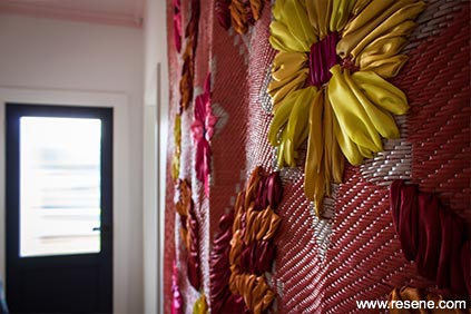 A vibrant woven matt hung in the entryway