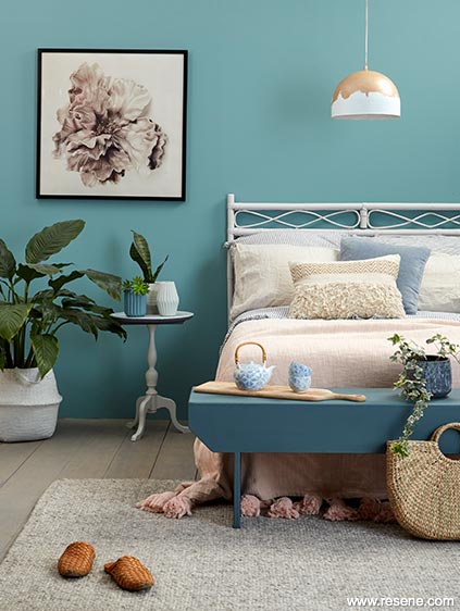 A restful Nordic blue green bedroom