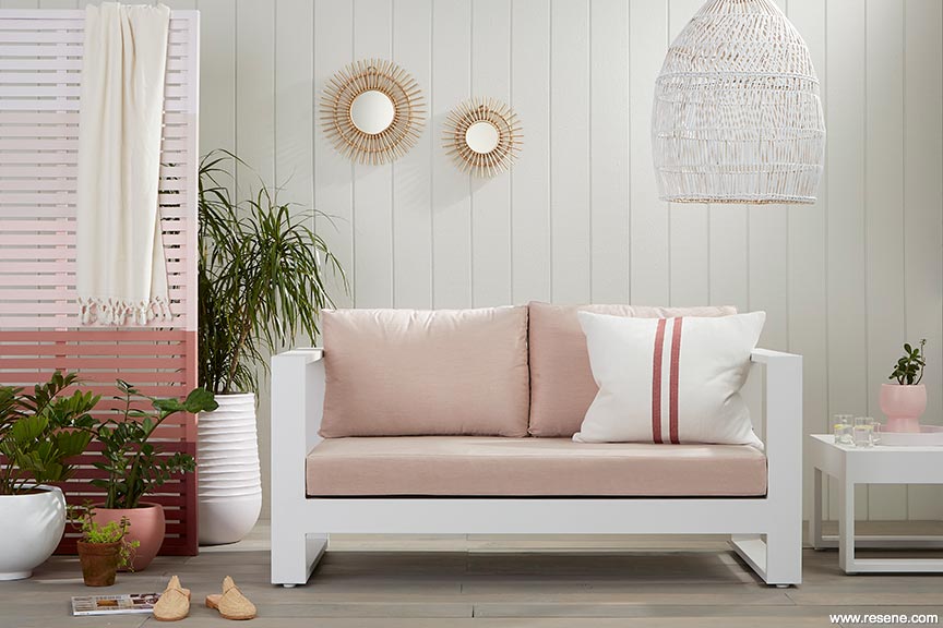 An outdoor seating area in white, creams and pinks