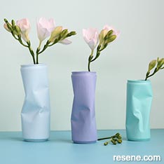 Upcycle crumpled cans into arty vases
