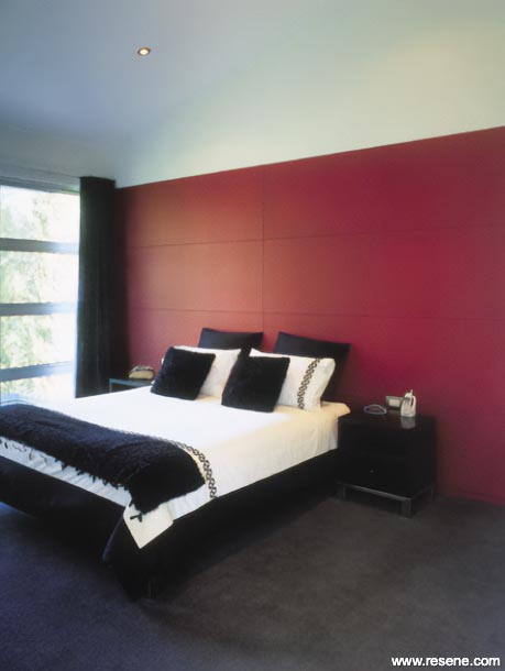 Bold red bedroom feature wall