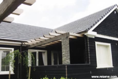 Stained black timber weatherboards