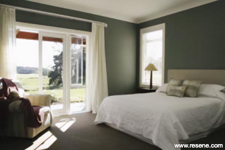 A tranquil green master bedroom