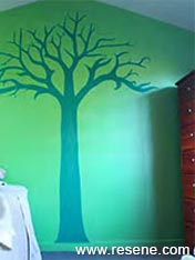 Wall mural of a tree in a boy's room