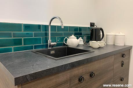 A blue and green kitchen