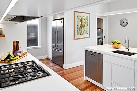 White kitchen with timber flooring