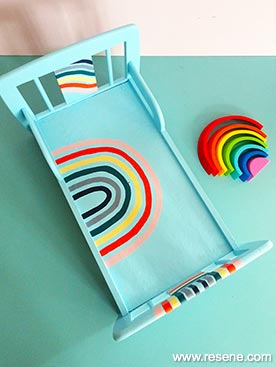 Repaint an dolls bed with a bright rainbow design