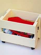 Paint a wooden crate to make a storage box