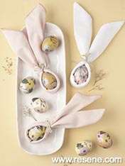 Make eggs with paper cutouts and bunny ears