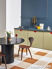 Retro kitchen painted in earthy tones and painted floor
