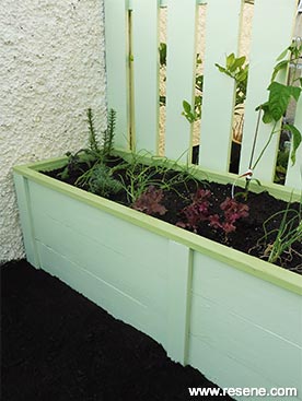 Paint a wooden planter box